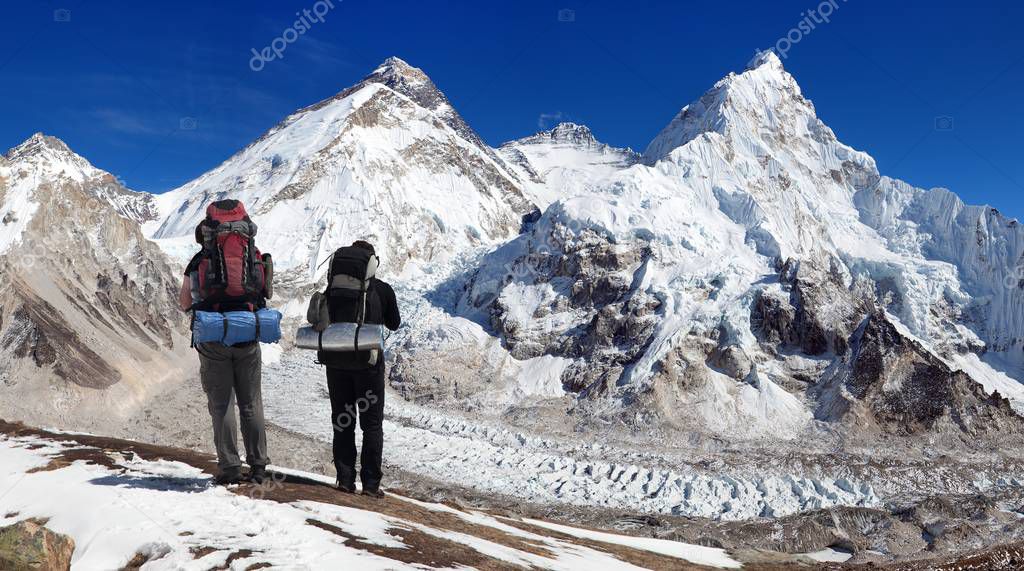 Mount Everest, Lhotse and Nuptse with two tourists