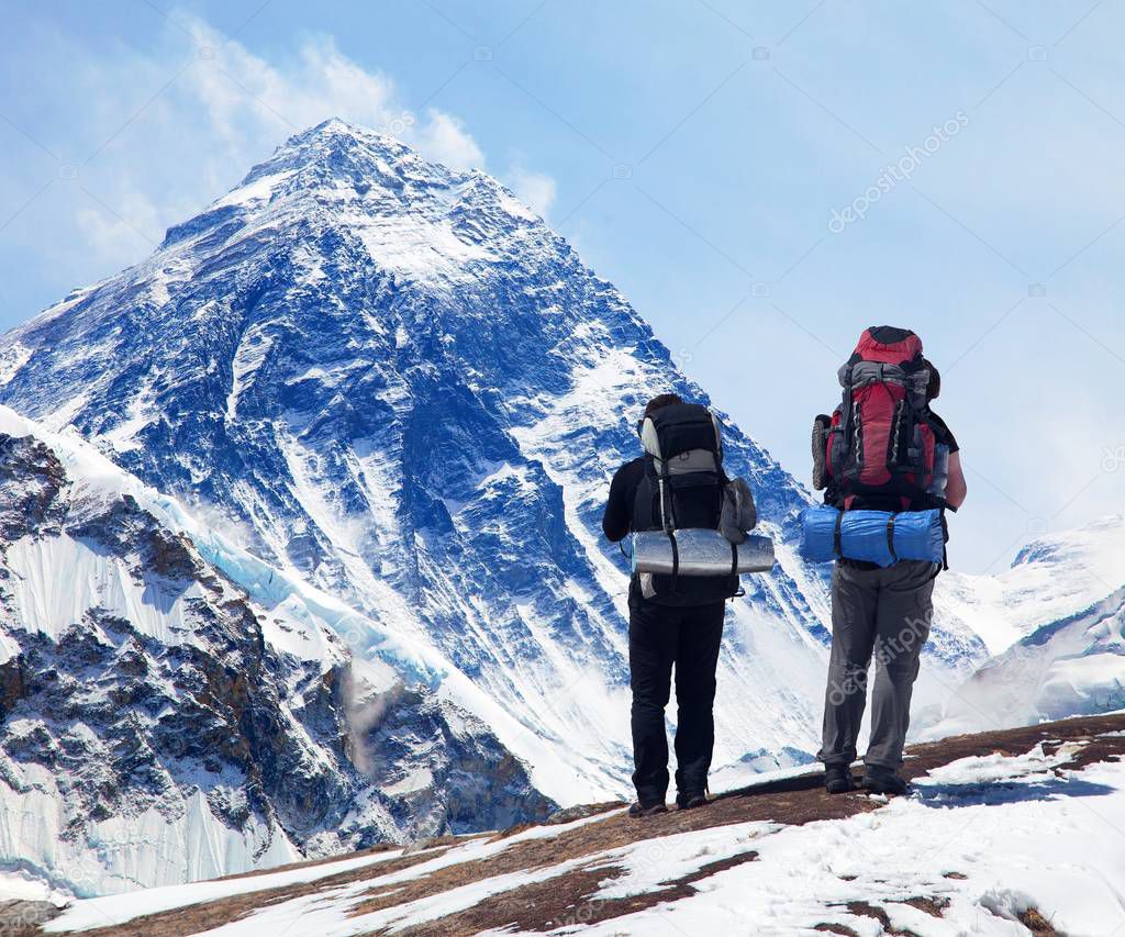 Mount Everest from Kala Patthar with two tourists