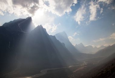 Sun beams in Himalayas mountains clipart