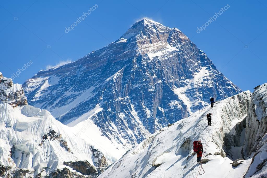 view of Everest from Gokyo valley with group of climbers