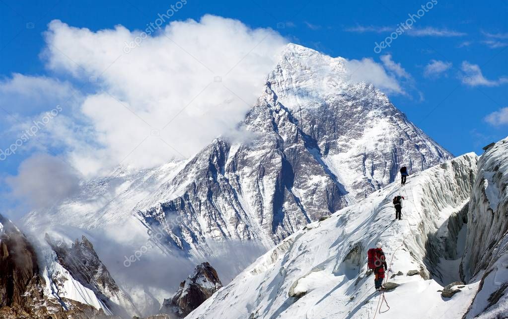 view of Everest from Gokyo valley with group of climbers