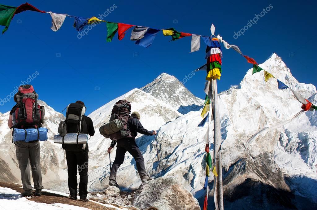Mount Everest with tourists and prayer flags