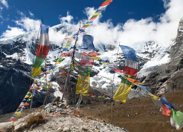 Buddhist prayer flags and Peak 7 VII, Nepal Himalayas