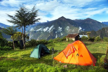 Camp site with two tents, view from Choquequirao trekking trail, Cuzco area, Machu Picchu area, Peruvian Andes clipart