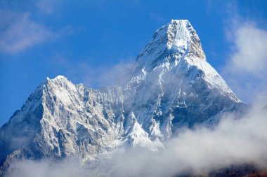 Mount Ama Dablam within clouds, way to Everest base camp, Khumbu valley, Sagarmatha national park, Everest area, nepalese himalayas, Nepal clipart