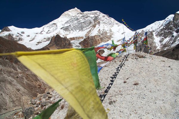 Mount Makalu and buddhist prayer flags, Maklu Barun national park, Nepal Himalayas