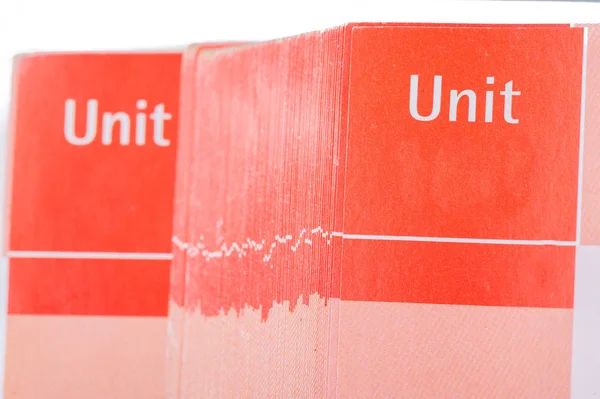 Páginas de livro escolar vermelho com espaço para o número da unidade — Fotografia de Stock