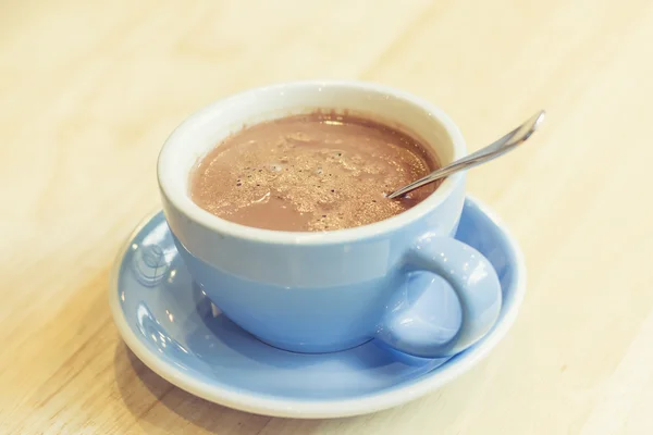 Hot chocolate cup on wooden table — Stock Photo, Image