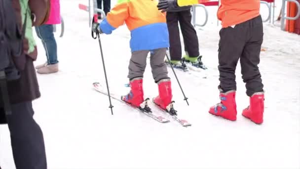 Group of people start playing ski with old person — 비디오