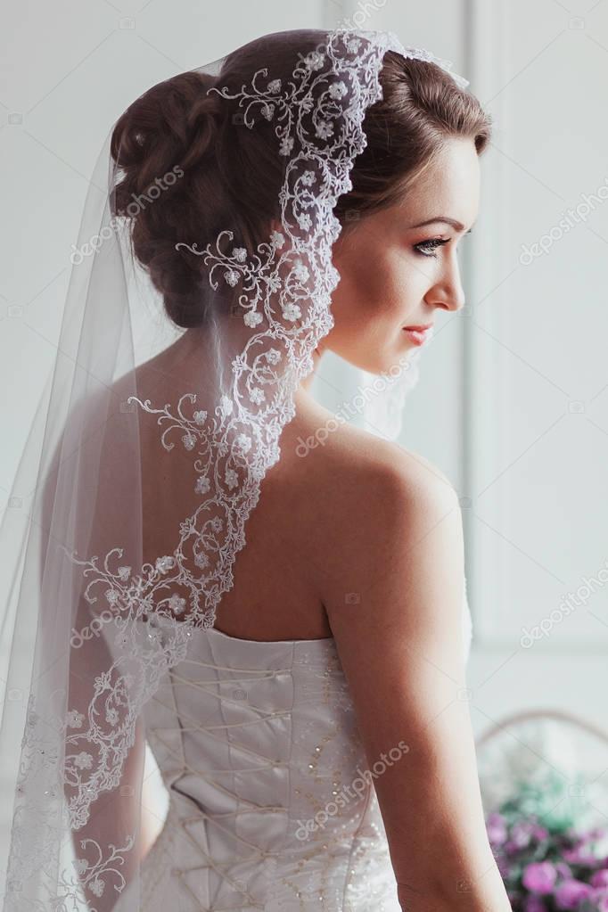 Beautiful Bride With Fashion Wedding Hairstyle On White