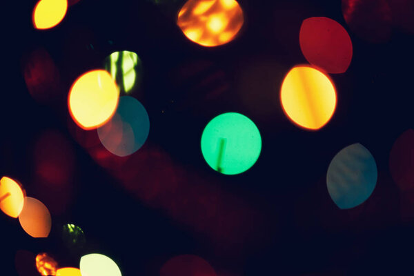 Christmas, New Year background with beautiful bokeh of colorful garland lights