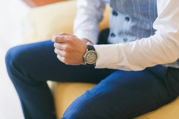 Watch on mans hand. Groom preparing for wedding ceremony. Close-up shot