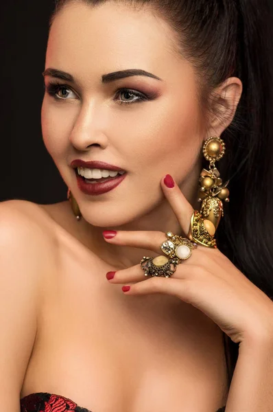 Brunette model with stylish earrings