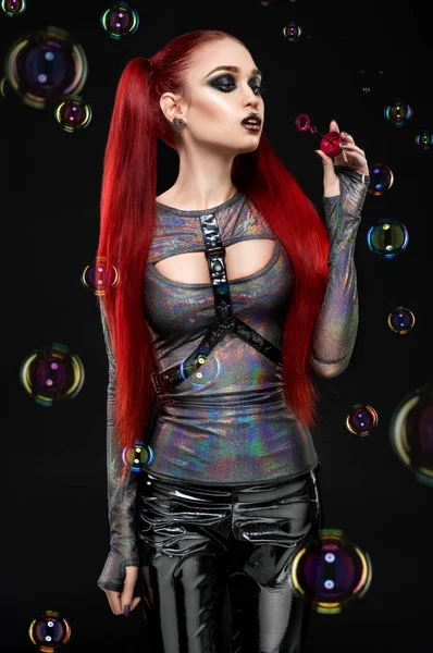 Redhair model blowing air bubbles — Stock Photo, Image