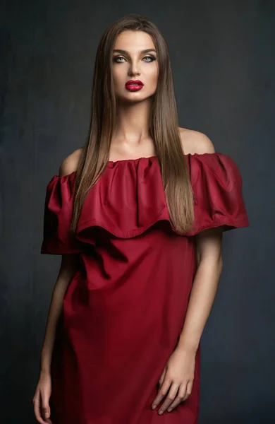 Young lady in red dress — Stock Photo, Image