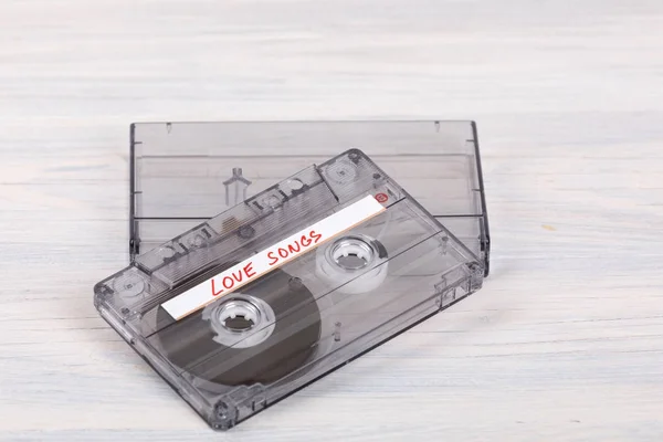 Audio cassette tape on wooden background — Stock Photo, Image