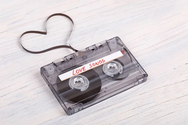 Audio cassette tape on wooden background. audio film shaping hea — Stock Photo, Image