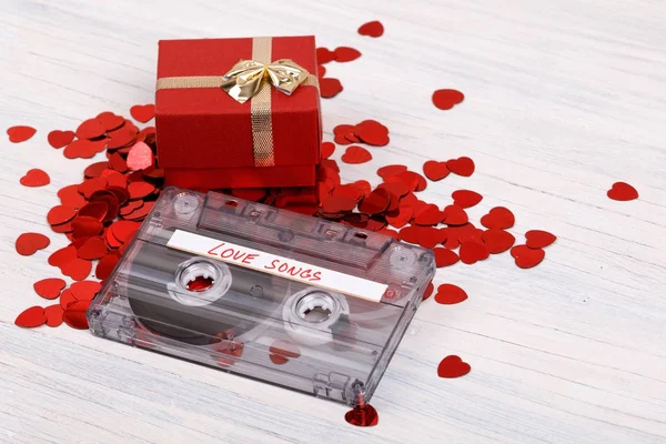 Audio cassette tape and small hearts — Stock Photo, Image