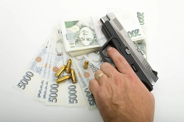 Gun and czech banknotes, crime concept — Stock Photo, Image