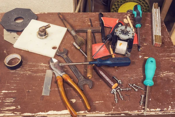 Tools on table in workshop room — Stock Photo, Image