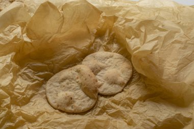 Two bread cakes are on a gold background.