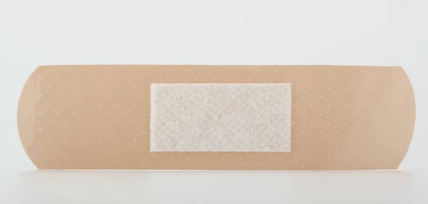 Close-up em um gesso pegajoso isolado em branco — Fotografia de Stock