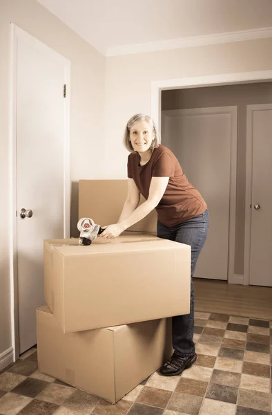 Mature Woman Prepares Move Another House Closing Boxes Tape Royalty Free Stock Photos