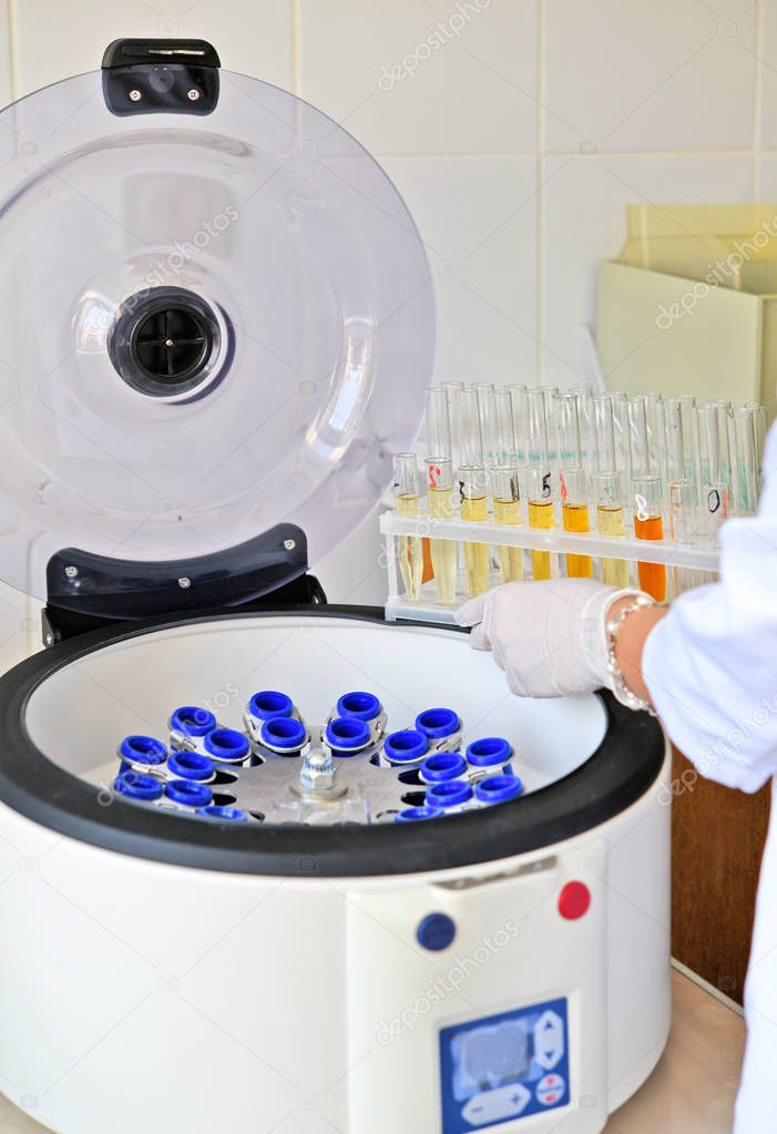 Sample loading at Elmi Centrifuge  in the laboratory of the clinic.