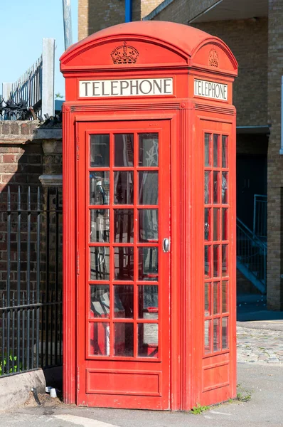 Traditional old style UK empty red phone box