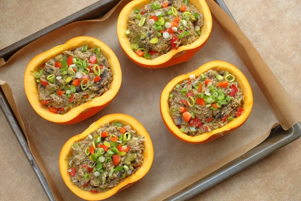 Autumn stuffed pumpkin with rice and mushrooms ready to bake — Stock Photo, Image