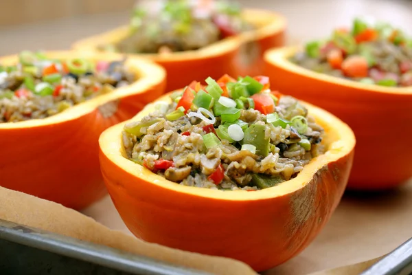 Autumn stuffed pumpkin with rice and mushrooms ready to bake — Stock Photo, Image