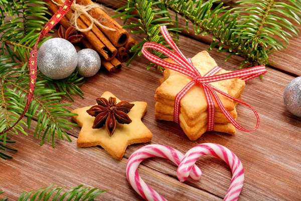 Christmas cookies with decoration on wooden background — Stock Photo, Image