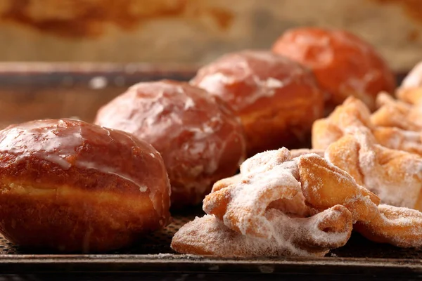 Donuts and faworki. Traditional Polish cookies on Fat Thursday — Stock Photo, Image