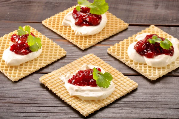 Yellow waffle with cottage cheese and jam