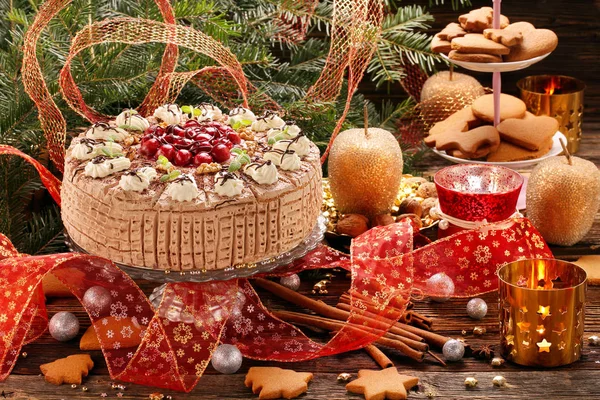 Christmas cake nut chocolate with cherries and gingerbreads — Stock Photo, Image