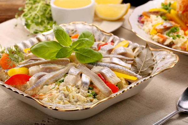 Christmas herring salad with lemon dip — Stock Photo, Image