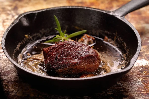 Beef steak on cast iron skillet — Stock Photo, Image