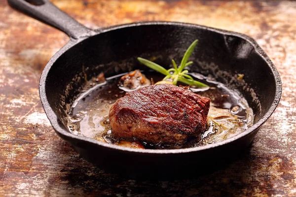 Beef steak on cast iron skillet