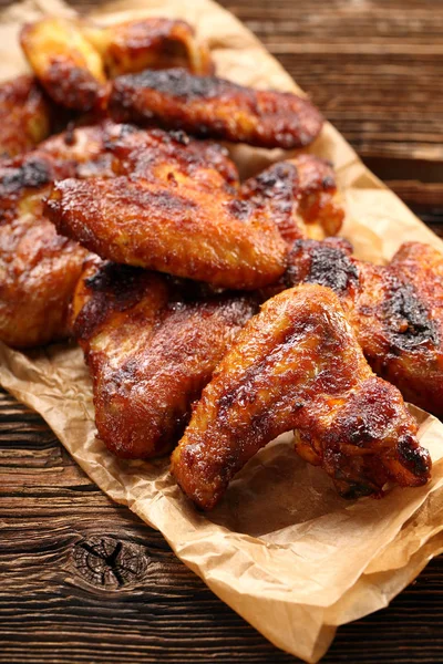 Chicken wings baked wings on wooden background — Stock Photo, Image