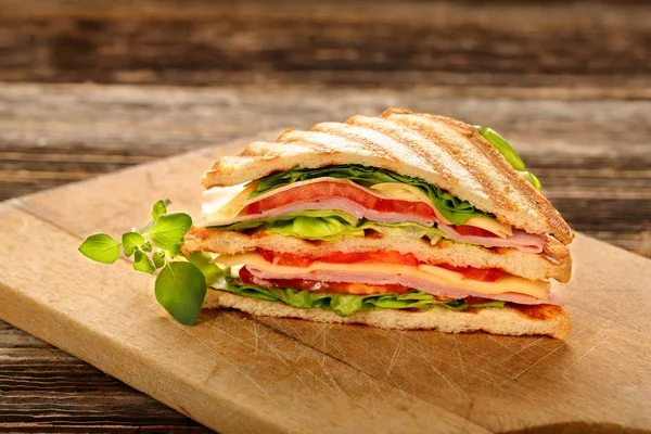 Fresh sandwiches on wooden background — Stock Photo, Image