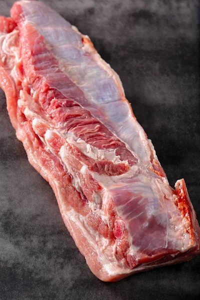 Raw ribs on stone background — Stock Photo, Image