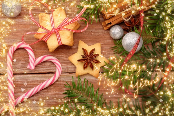 Christmas cookies with decorations on wooden background with hap — Stock Photo, Image