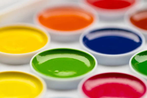 Palette of watercolors isolated against a white background