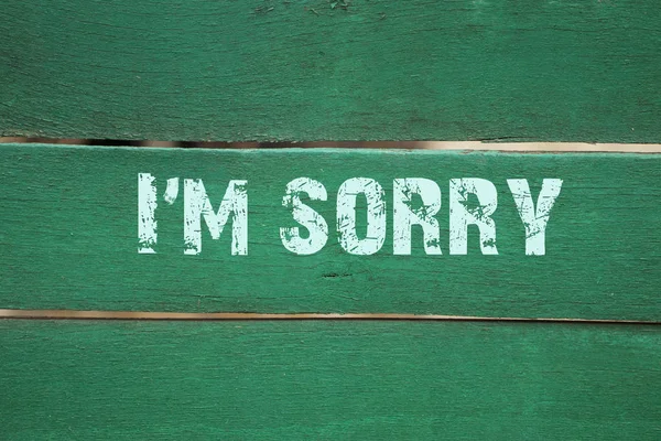 I'm sorry- phrase written on old green background — Stock Photo, Image