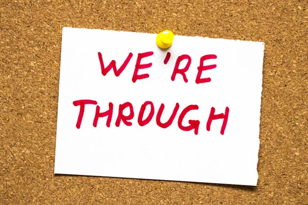 The words "We're through" on the cork Board — Stock Photo, Image
