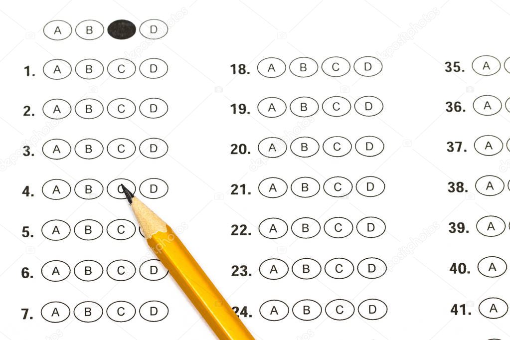 Test score sheet with answers and pencil