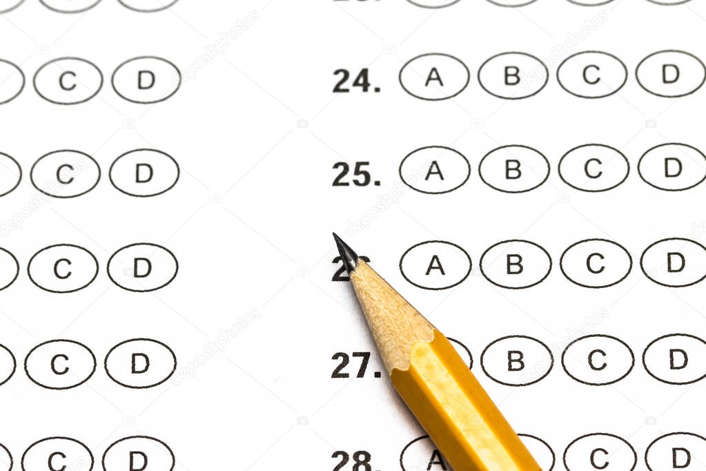Test score sheet with answers and pencil