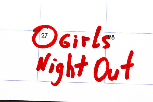 "girls night out " is the text written on the calendar in red ma