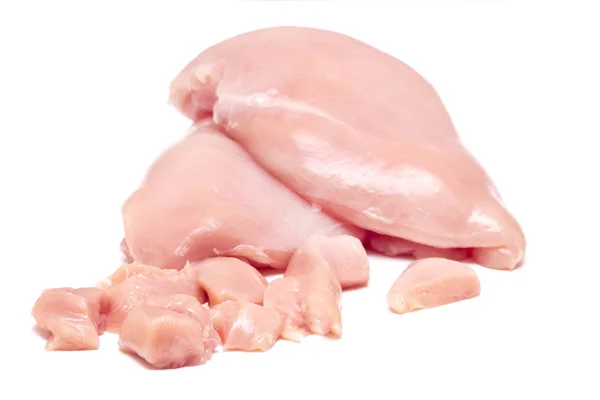 Widok z góry fragmentów filet kurczaka surowego na białym tle — Zdjęcie stockowe