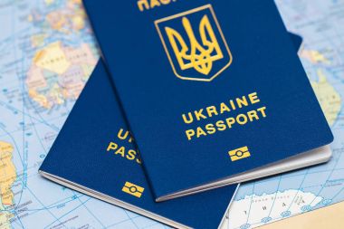 Ukrainian travel passport on a world map clipart